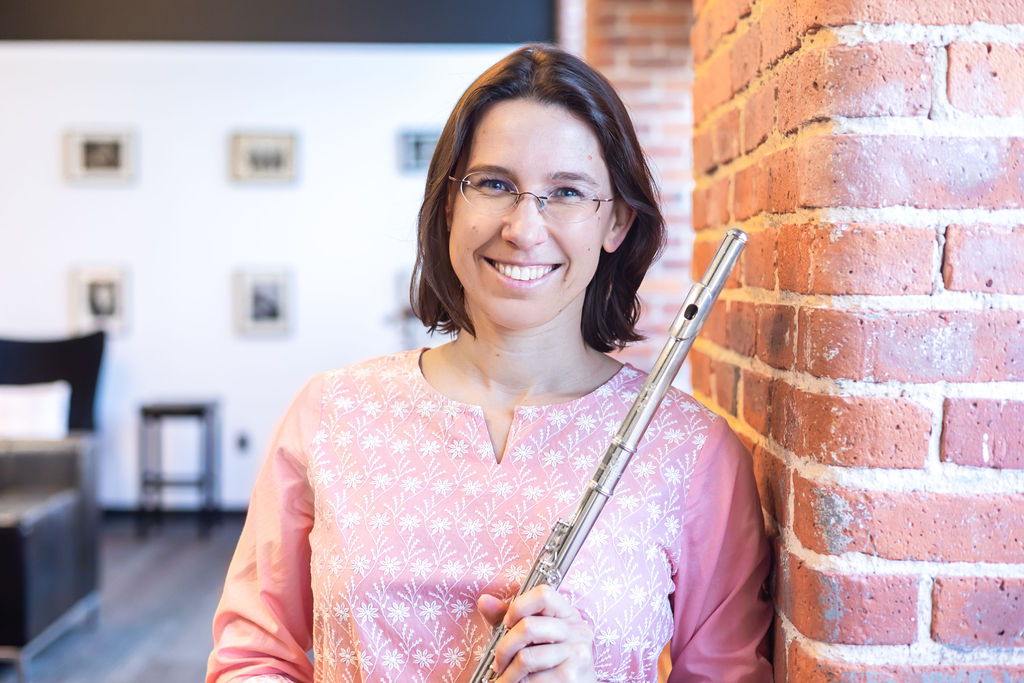 friendly musician holding a flute